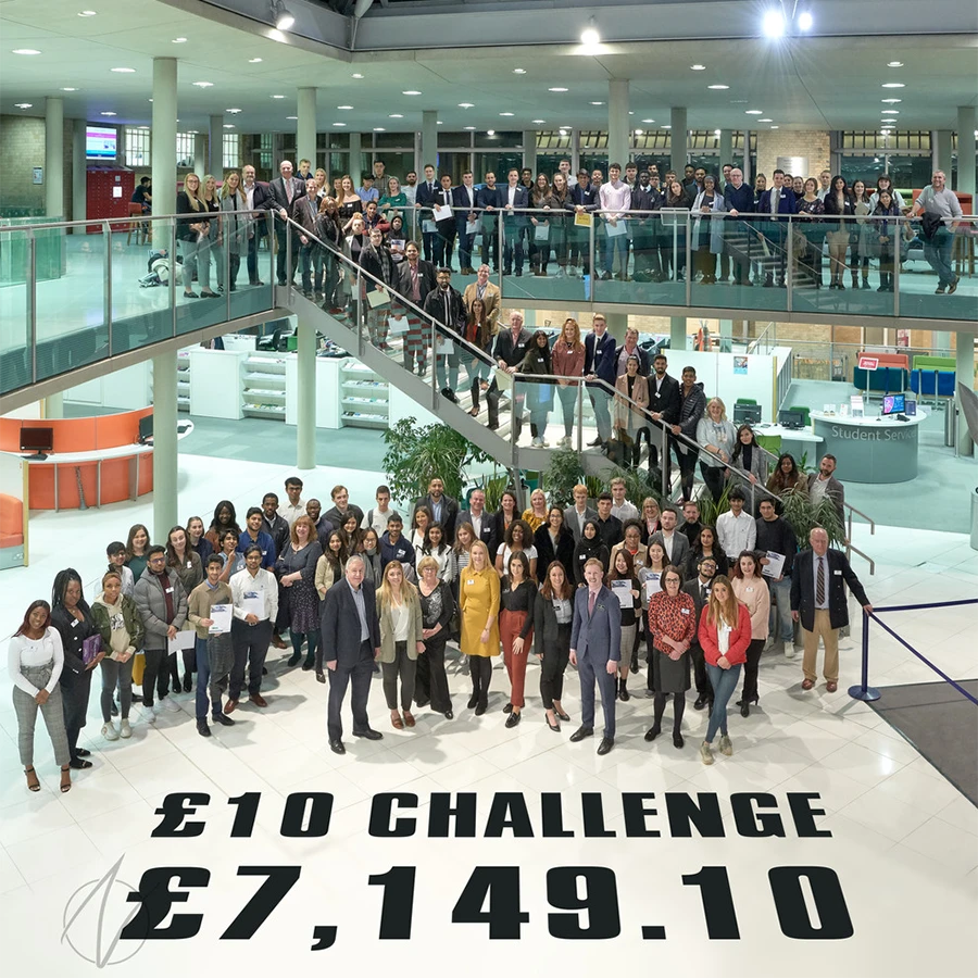 Large group photo of participants at the £10 Challenge corporate event