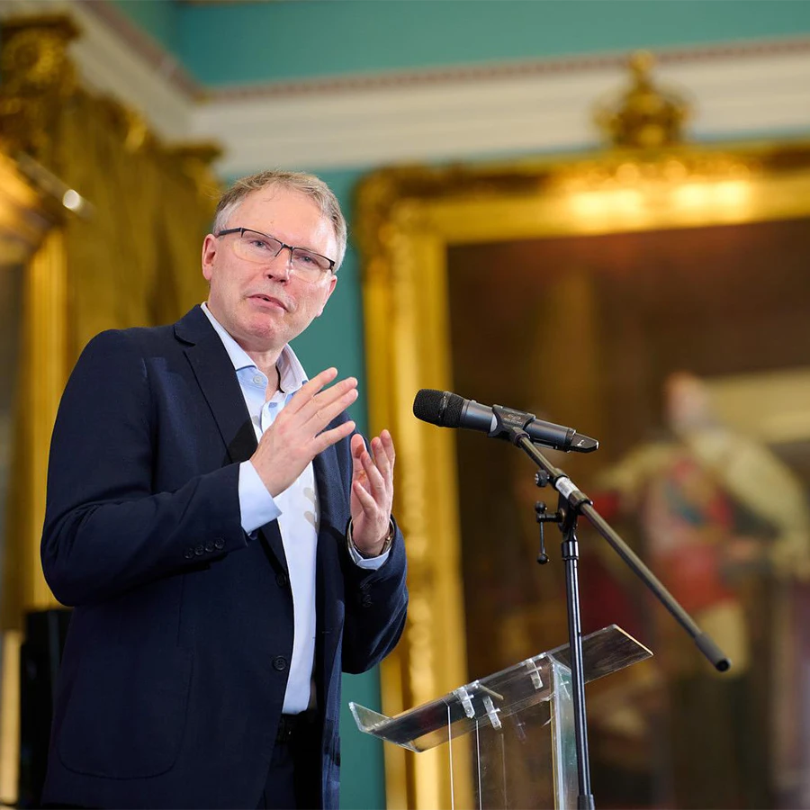 Lord delivering a keynote address at a corporate event