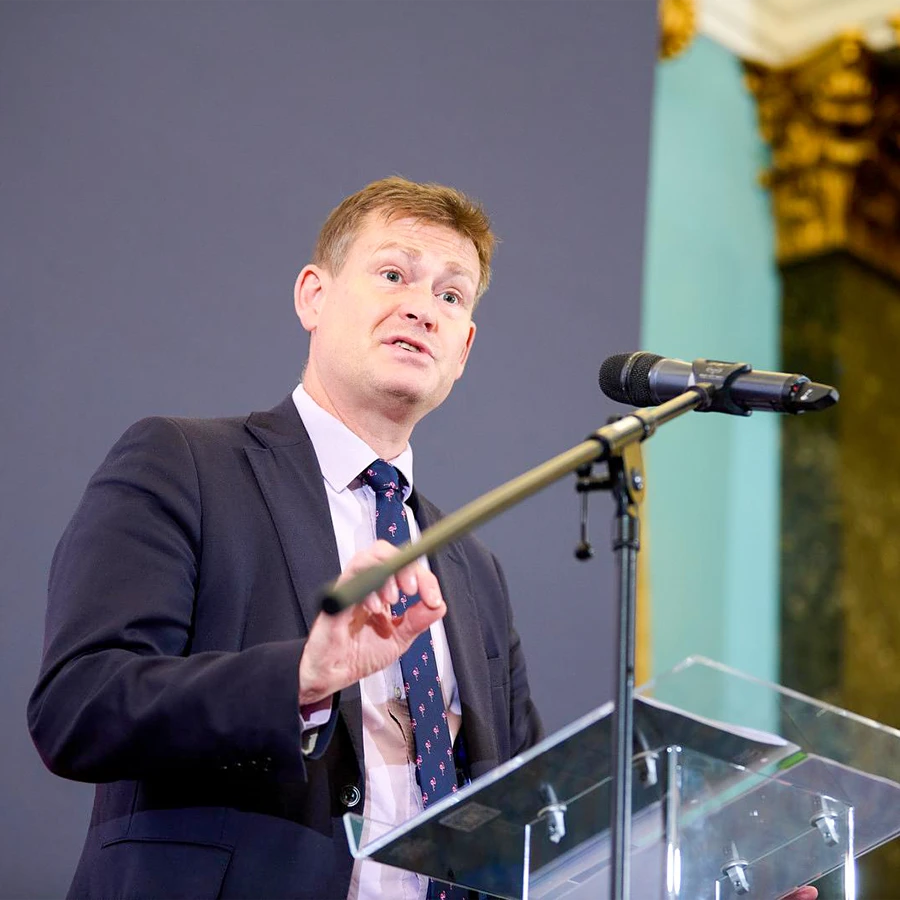 Politician delivering a keynote address at a corporate event