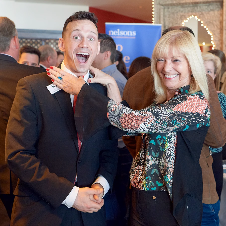 Delegates sharing a fun moment during a networking session at a corporate event