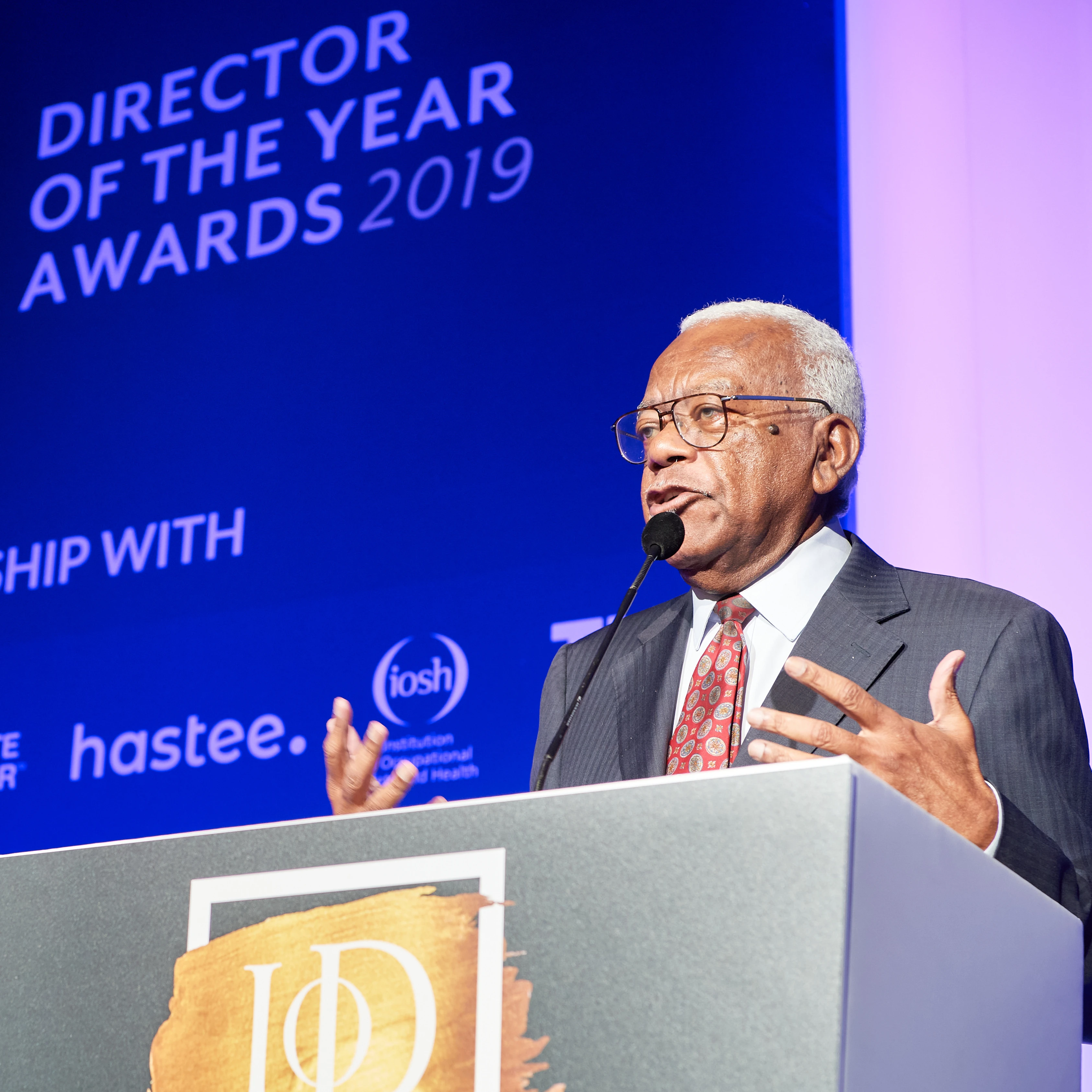 Sir Trevor McDonald in conversation at a corporate networking event