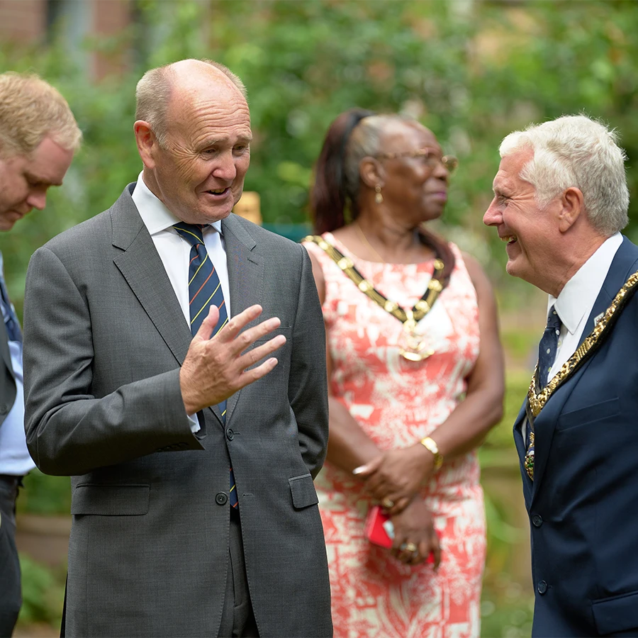 Dignitaries in conversation at a royal event